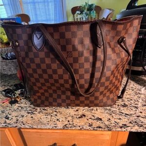 100% Authentic Louis Vuitton never full